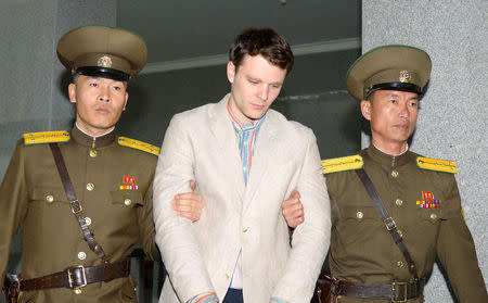 FILE PHOTO: Otto Frederick Warmbier (C), a University of Virginia student who was detained in North Korea since early January, is taken to North Korea's top court in Pyongyang, North Korea, in this photo released by Kyodo March 16, 2016. Mandatory credit Kyodo/via REUTERS