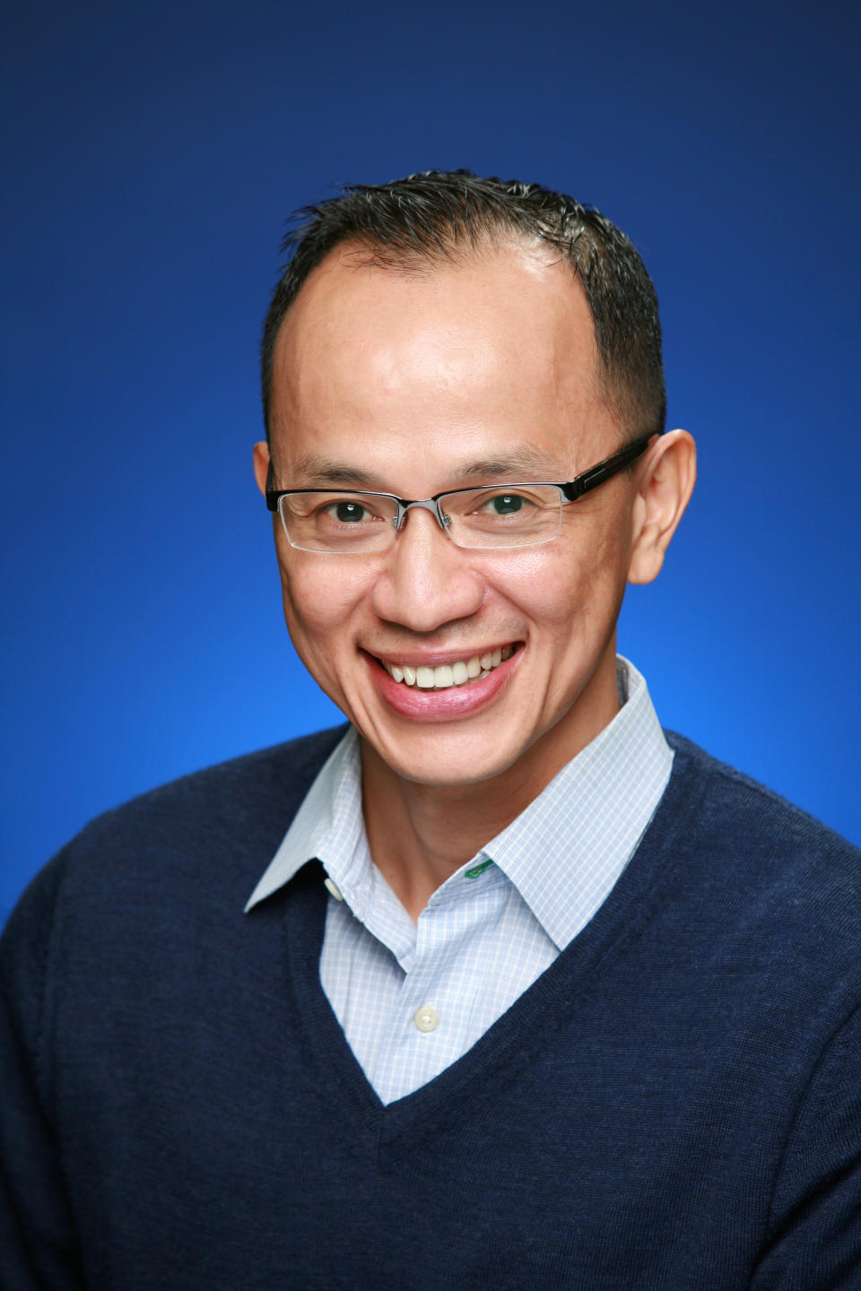 Smiling headshot of QSC's Joe Pham.