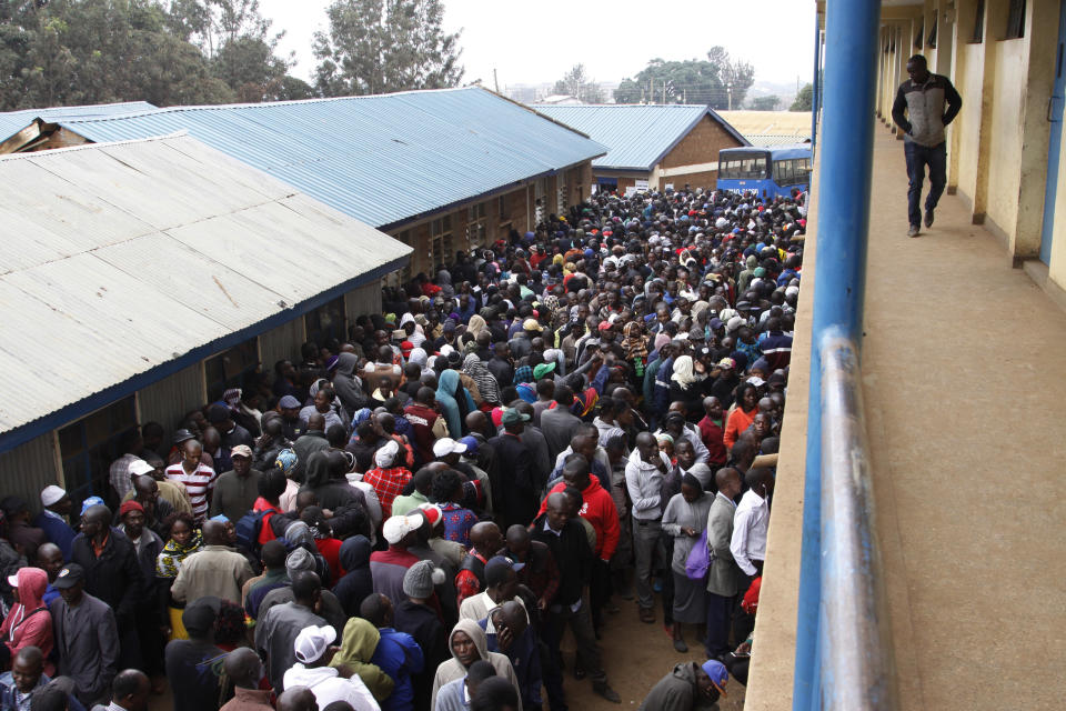 <p>Voters line up in the early morning in cold weather at a polling station in the Kibera Slums Nairobi, Kenya, Tuesday, Aug. 8, 2017, to cast their ballot. (Photo: Khalil Senosi/AP) </p>