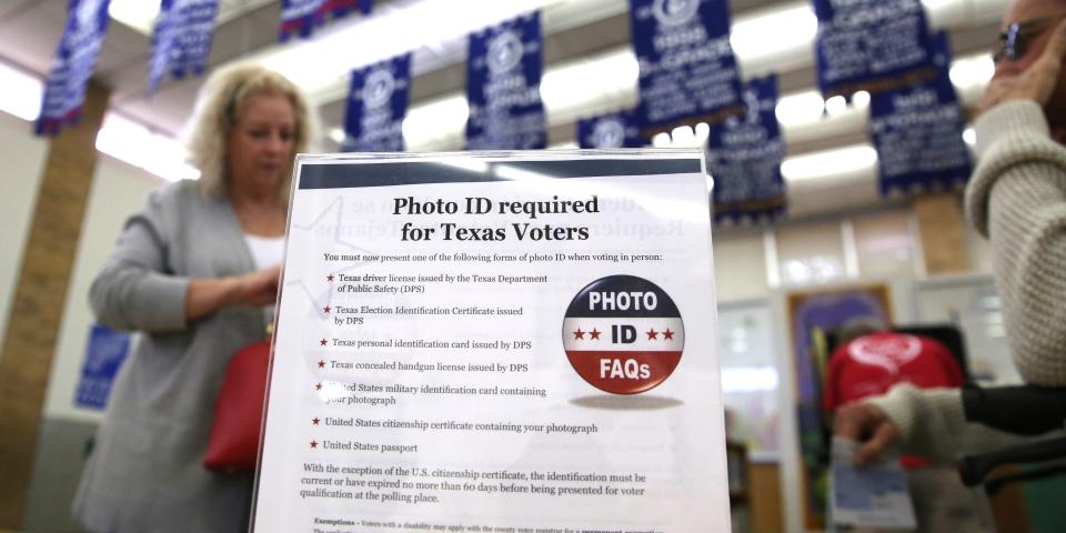 A sign at a polling place in 2016 informs Texas voters of the state's ID requirements for voters.