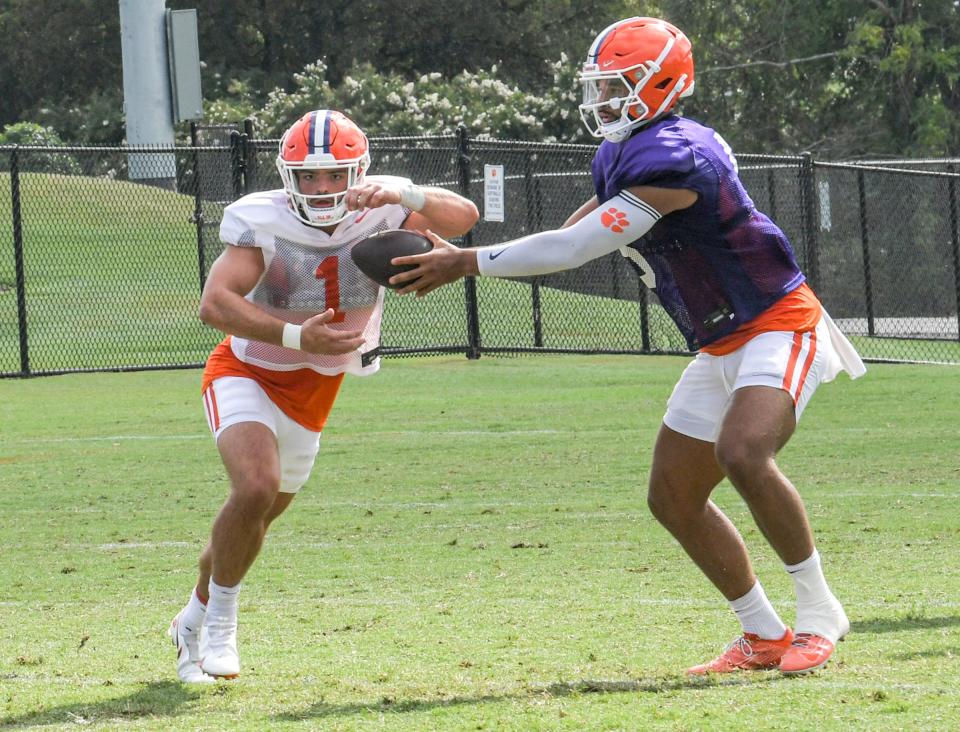 Clemson quarterback D.J. Uiagalelei (5) hands off to running back Will Shipley (1)  during practice in Clemson Friday, August 12, 2022. 