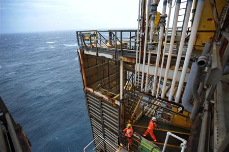 Employees work on the BP Eastern Trough Area Project (ETAP) oil platform in the North Sea, around 100 miles east of Aberdeen in Scotland February 24, 2014. REUTERS/Andy Buchanan