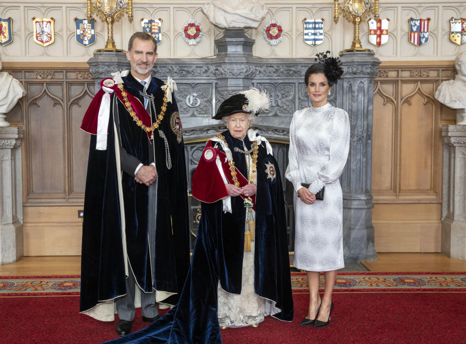 Queen Elizabeth II (centre) with King Felipe VI of Spain and his wife, Queen Letizia, in St George's Hall, at Windsor Castle, after the king was invested as a Supernumerary Knight of the Garter, ahead of the Order of the Garter Service at St George's Chapel.