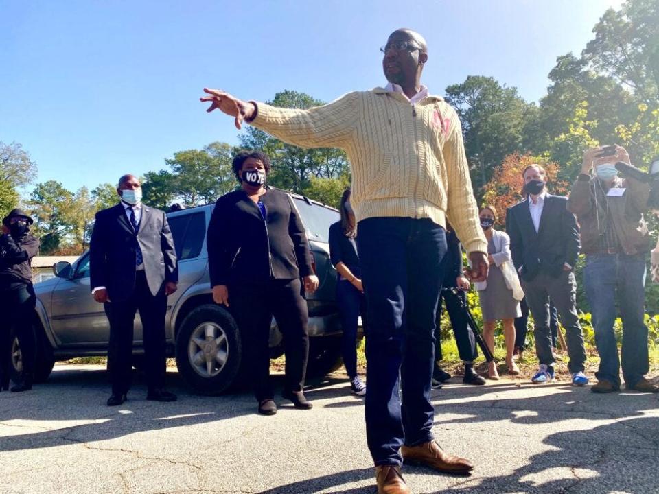 The Rev. Raphael Warnock (front) campaigns with Stacey Abrams (back) on Nov. 3, 2020. (Photo by Beau Evans)
