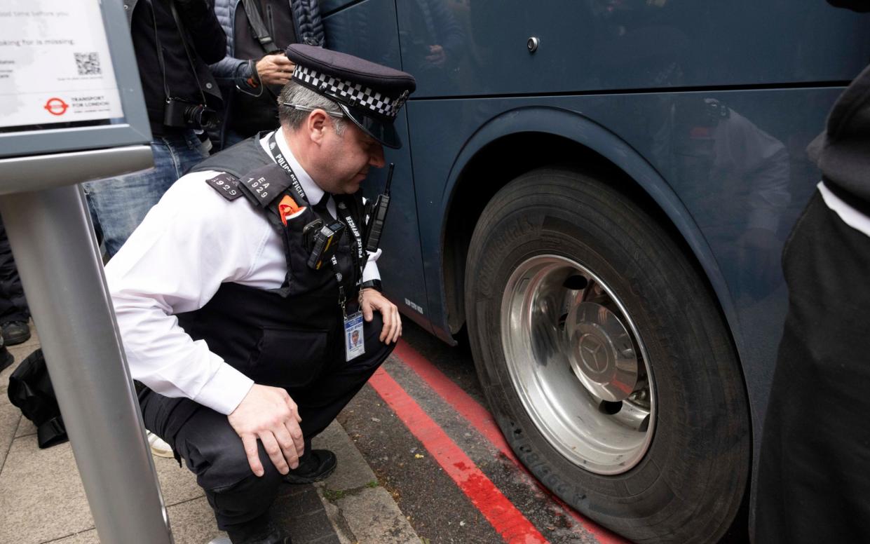 Protestors slashed the coach's tyres in a bid to keep migrants at the hotel in south London