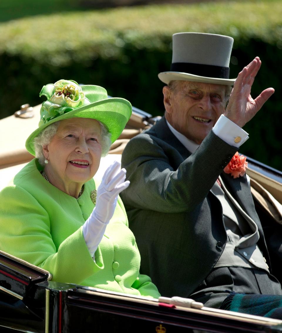 <p>Britain’s Queen Elizabeth II, waves to the crowd with Prince Philip at right, as they arrive by open carriage to the parade ring on the first day of the Royal Ascot horse race meeting in Ascot, England, Tuesday, June 20, 2017. (AP Photo/Alastair Grant) </p>