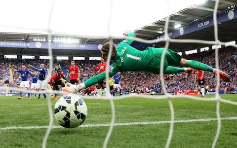 David De Gea dives in vain as Leicester's Esteban Cambiasso scores his team's third goal from the penalty spot  - Credit: Getty Images