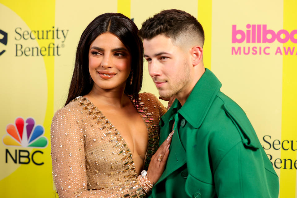 LOS ANGELES, CALIFORNIA - MAY 23: (L-R) Priyanka Chopra Jonas and Nick Jonas pose backstage for the 2021 Billboard Music Awards, broadcast on May 23, 2021 at Microsoft Theater in Los Angeles, California. (Photo by Rich Fury/Getty Images for dcp)