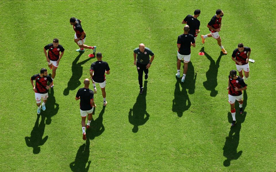 Tunisia players warm up prior to the FIFA World Cup Qatar 2022 Group D match between Tunisia and Australia at Al Janoub Stadium on November 26, 2022 in Al Wakrah, Qatar. - Matthias Hangst/Getty Images