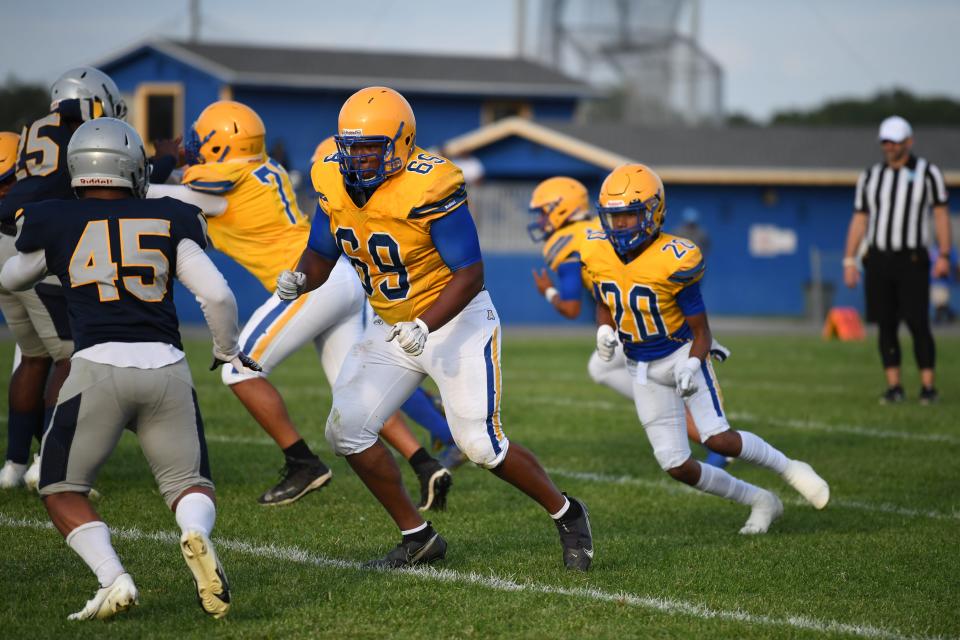Auburndale offensive lineman Nate Gabriel (69) prepares to block in a jamboree contest versus Ridge Community. Gabriel this year is expected to make a huge impact.