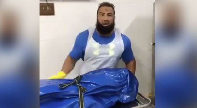 Undertaker Ahmad Hraichie has shared the footage of himself warning other Muslims while standing with a body bag. Photo: Facebook/ The Australian Muslim