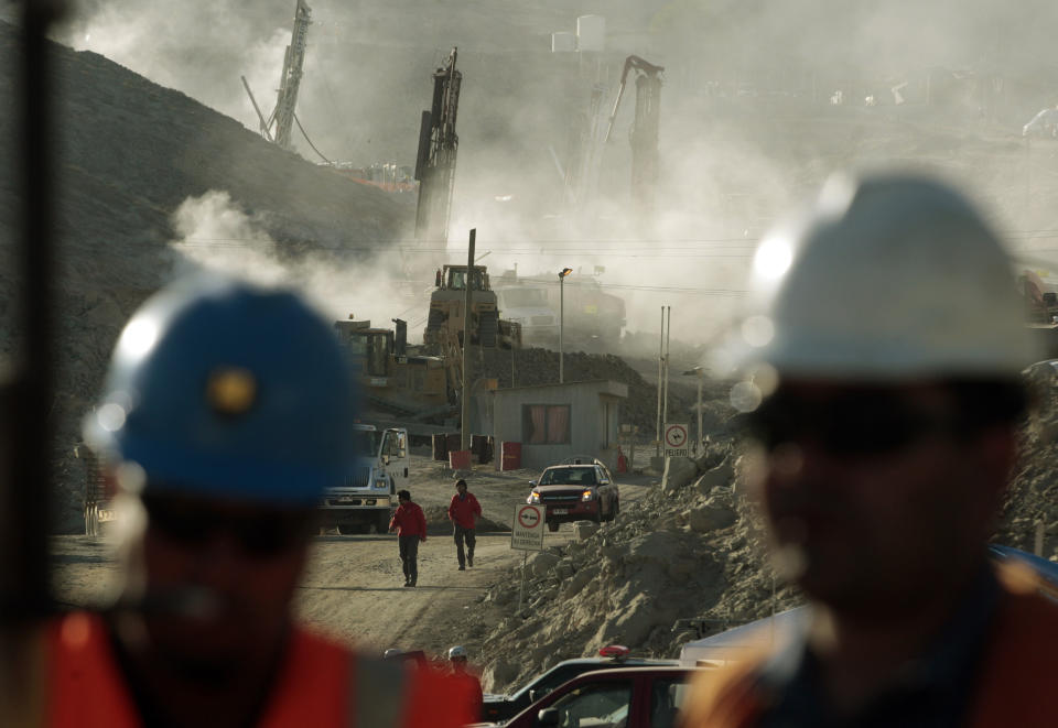 FILE - In this Aug. 9, 2010 file photo, a drill machine being used to try to contact 33 trapped miners stands in the distance in Copiapo, Chile. Chile marks on Sunday, Aug. 5, 2012 the two year anniversary since 33 miners were trapped in the mine that collapsed and trapped them for 69 days before their rescue. (AP Photo/Luis Hidalgo, File)