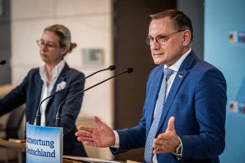 Tino Chrupalla, federal chairman and parliamentary group leader of the Alternative for Germany (AfD) party, speaks alongside Alice Weidel, parliamentary group leader, during a press statement before the start of the party's parliamentary group meeting. Michael Kappeler/dpa
