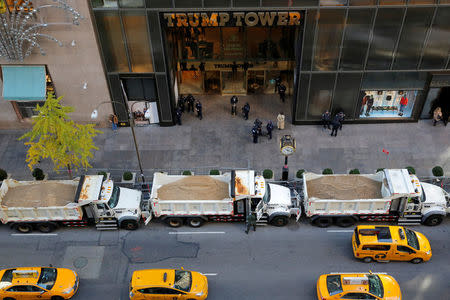 FILE PHOTO - Sanitation trucks filled with sand act as barricades along Fifth Avenue outside Republican presidential nominee Donald Trump's Trump Tower in Manhattan, New York, U.S. on November 8, 2016. REUTERS/Andrew Kelly/File Photo