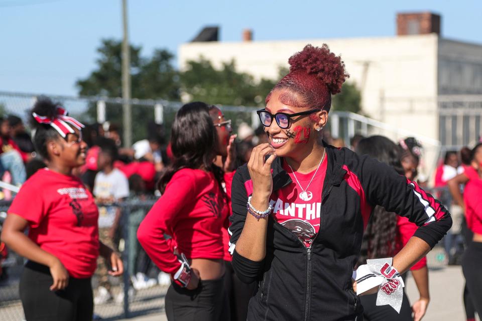 Senior Da'Kaylah Napier talks to her teammates during a break on the sideline during a football game between University Prep Academy and University Prep Science and Math at Plymouth Education Center in Detroit on Sept. 14, 2023. In addition to cheerleading, Napier runs track and is in the National Honor Society, President of the Student Council, and a member of Grand Valley State University TRIO Upward Bound Detroit. She says, "I think that all of the extracurricular activities and programs I'm involved in will play a big role in helping me stand out to colleges as it shows that I'm a very involved student in my school dynamic. It also helps to illustrate the fact that I can be an athlete and leader in various environments while still maintaining good academics." In an increasingly selective admissions environment, experts on getting into college say extracurricular activities are an important part of getting noticed by admissions committees. Students who take leadership roles in their clubs or organizations, who go outside of school walls to engage with the community, or who can show outcomes from their involvement in causes or clubs will stand out.