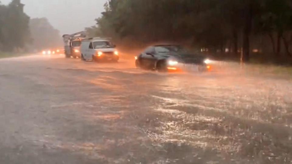 PHOTO: In this screen grab taken from a video that was posted to social media, cars drive through flood waters in the Houston, Texas, area on May 2, 2024. (@StormChasterHTX )