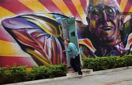 A pensioner leaves a cultural centre at Benedito Calixto Square in Sao Paulo April 2, 2014. REUTERS/Nacho Doce