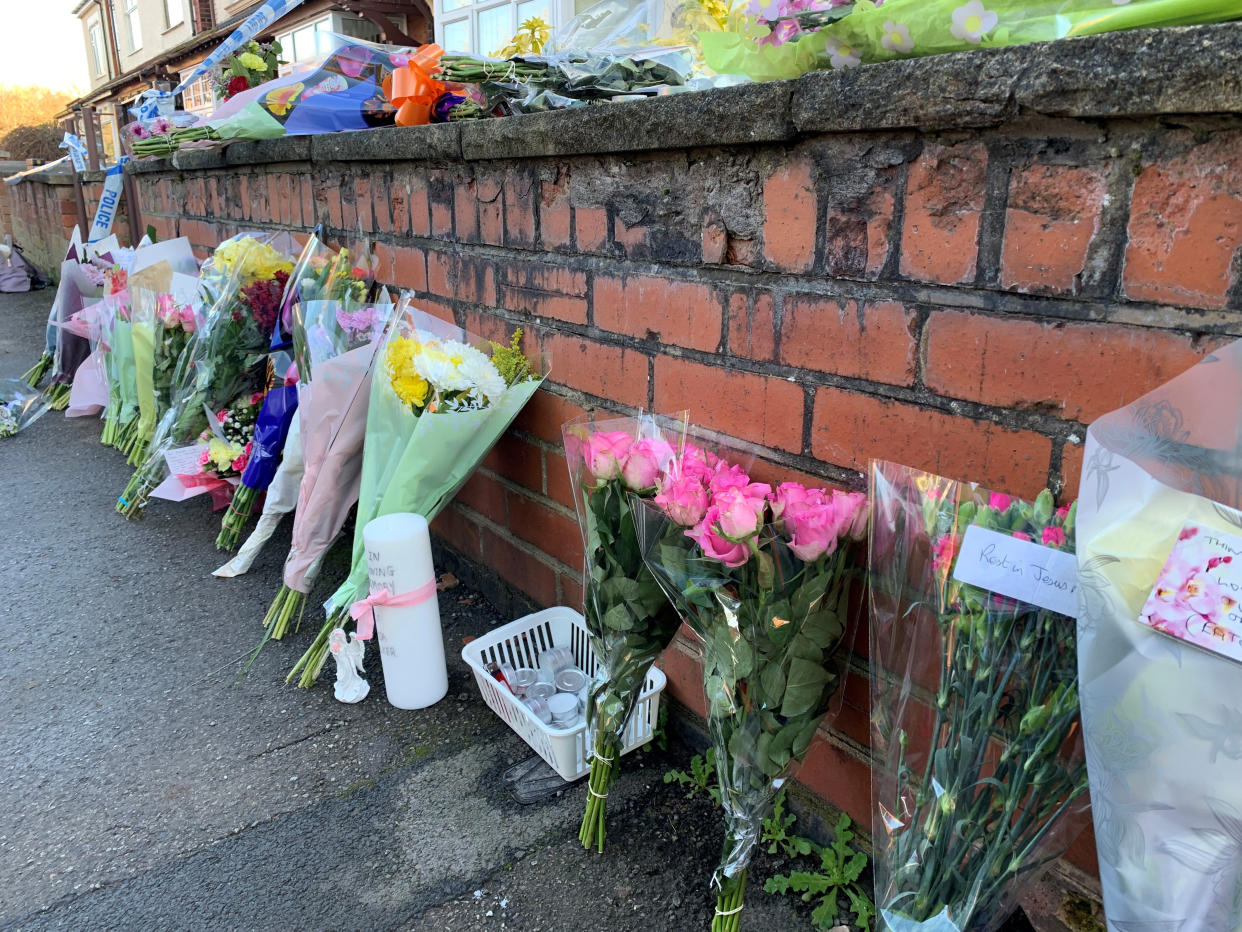 Flowers outside a house on Station Road, Langwith Junction, Shirebrook, near Bolsover, where Kenneth Walker 86, was found with life-threatening injuries alongside his wife Freda Walker 88, who was pronounced dead at the scene.