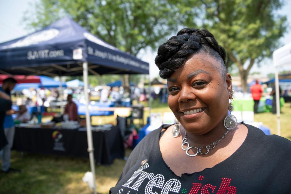 Latorya Greene poses for a portait at the Juneteenth celebration in LaSalle Park in South Bend on June 17, 2023. She is part of SBCIBE (South Bend Indiana Black Expo), which helped to put on the celebration.