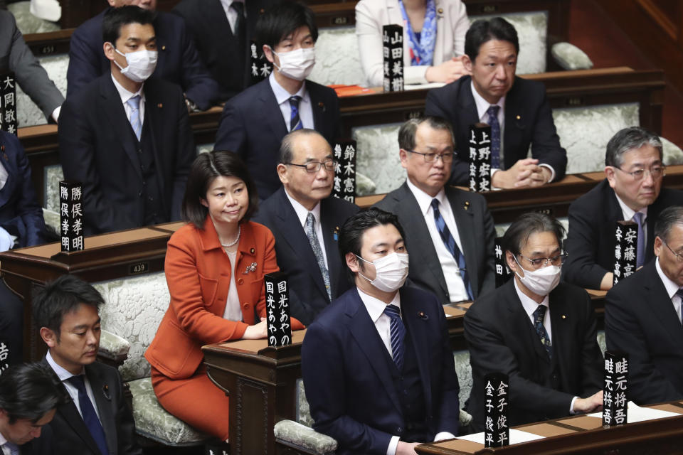 FILE - In this March 12, 2020, file photo, lawmakers attend a plenary session at the Lower House in Tokyo. The inclusion of two women among the four candidates vying to become the next prime minister seems like a big step forward for Japan's notoriously sexist politics. But their fate is in the hands of a conservative, mostly male governing party - and the leading female candidate has been criticized by observers for her right-wing gender policies. (AP Photo/Koji Sasahara, File)