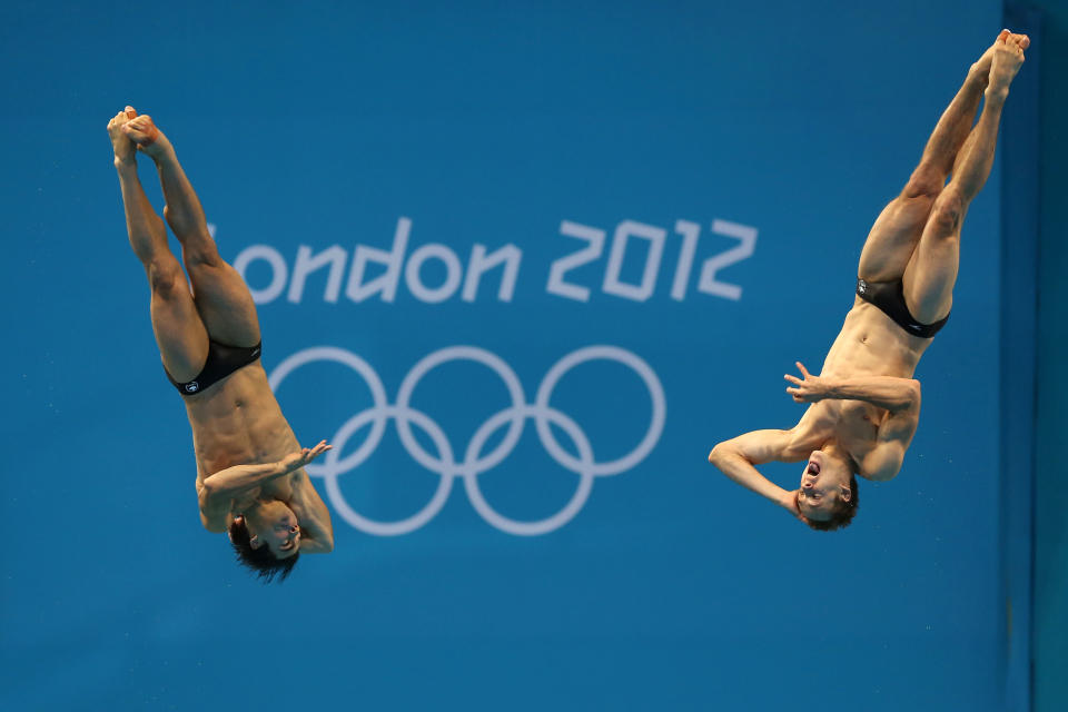LONDON, ENGLAND - AUGUST 01: Alexandre Despatie and Reuben Ross of Canada compete in the Men's Synchronised 3m Springboard Diving on Day 5 of the London 2012 Olympic Games at the Aquatics Centre on August 1, 2012 in London, England. (Photo by Clive Rose/Getty Images)