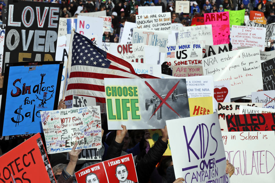 <p>Crowds hold signs on Pennsylvania Avenue before the March for Our Lives rally in support of stricter gun control on March 24, 2018, in Washington. (Photo: AP/Alex Brandon) </p>