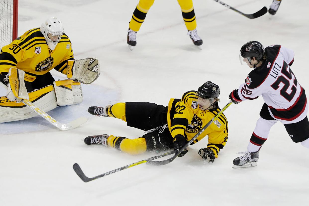 Green Bay Gamblers forward Josh Dunne slides to block a shot by Chicago Steel forward Reggie Lutz (25) on Feb. 25, 2017, at the Resch Center in Ashwaubenon.