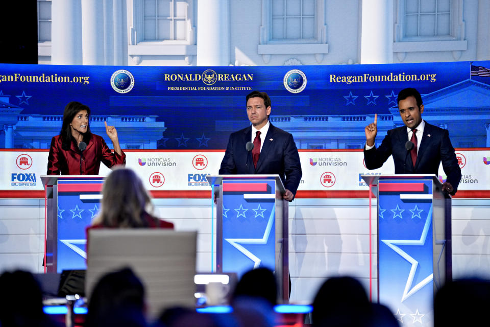 Former South Carolina Gov. Nikki Haley debates Florida Gov. Ron DeSantis and businessman Vivek Ramaswamy onstage at a GOP debate.