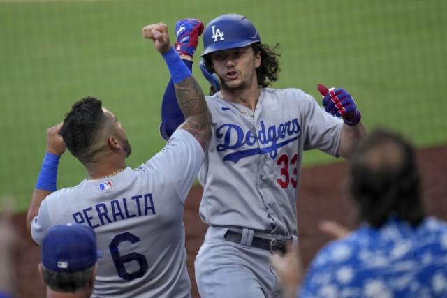 James Outman of the Los Angeles Dodgers runs to third base on a