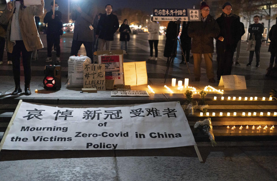 Demonstrators gather at Freedom Plaza in Washington, Sunday, Dec. 4, 2022, to protest in solidarity with the ongoing protests against the Chinese government's continued zero-COVID policies. (AP Photo/Jose Luis Magana)