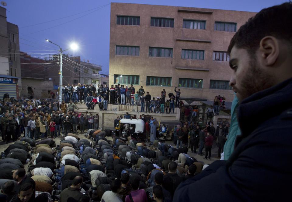 Relatives and friends of Sheik Omar Abdel-Rahman, who was convicted of plotting terror attacks in New York City in the decade before 9/11, pray sunset prayers as they wait for his coffin to arrive at the Grand Mosque, in the Nile Delta town of Gamalia, Egypt, Wednesday, Feb. 22, 2017. Abdel-Rahman, the so-called Blind Sheikh, was arrested in 1993 and convicted in 1995 along with nine followers of a conspiracy to blow up the United Nations and several New York landmarks. A symbol for radical Islamists, he had been serving a life sentence in a U.S. prison when he died on Saturday. (AP Photo/Amr Nabil)