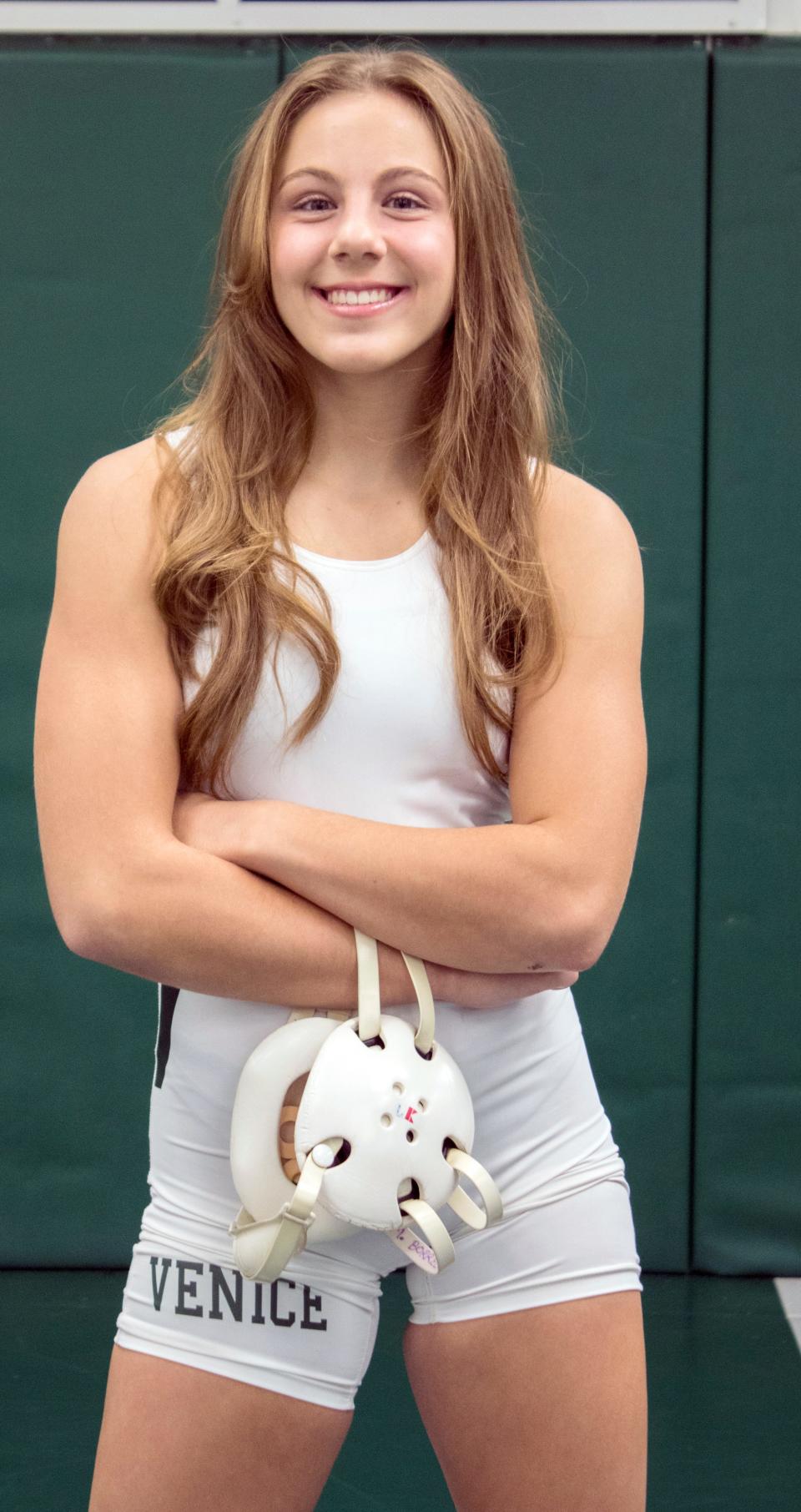 Milana Borrelli had to overcome a dislocated right elbow during her first season with the Venice High wrestling team. She recovered and went on to win a state championship, her second straight at the 120-pound weight class.