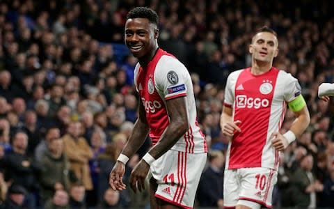 Quincy Promes of Ajax Celebrates 0-1 with Dusan Tadic of Ajax during the UEFA Champions League match between Chelsea v Ajax - Credit: GETTY IMAGES