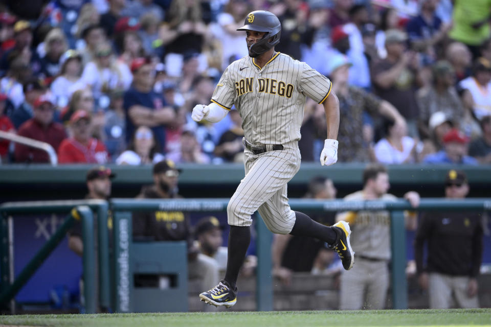 San Diego Padres' Xander Bogaerts runs towards home to score on a double by Rougned Odor during the fifth inning of a baseball game against the Washington Nationals, Thursday, May 25, 2023, in Washington. (AP Photo/Nick Wass)