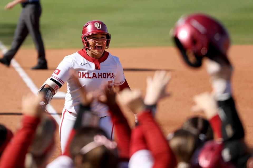 Oklahoma infielder Ella Parker (5) runs home after hitting a home run in the first inning of a Big 12 softball tournament game between the University of Oklahoma Sooners (OU) and the BYU Cougars at Devon Park in Oklahoma City, Friday, May 10, 2024. Oklahoma won 13-2.