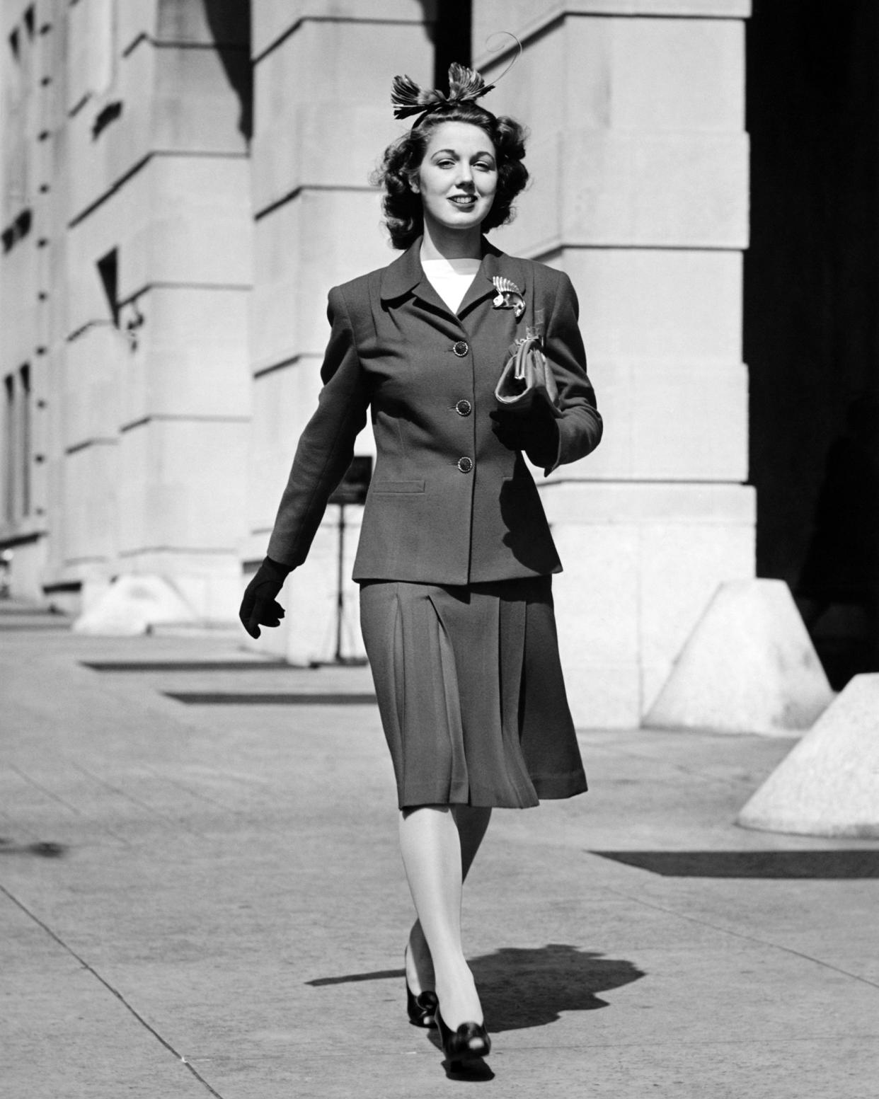 1930s woman wearing a suit with shoulder pads