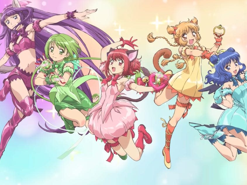 a group of colorful-looking girls from tokyo mew mew new wearing outfits that match their hair colors and withi assorted animal-like features such as cat/wolf ears or wings