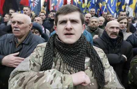 Activists of nationalist groups and their supporters take part in the so-called March of Dignity, marking the third anniversary of the 2014 Ukrainian pro-European Union (EU) mass protests, in Kiev, Ukraine, February 22, 2017. REUTERS/Valentyn Ogirenko