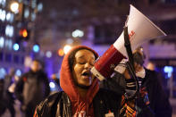 Mikki Chatles sings into a megaphone as demonstrators protest Friday, Jan. 27, 2023, in Washington, over the death of Tyre Nichols, who died after being beaten by Memphis police officers on Jan. 7. (AP Photo/Carolyn Kaster)