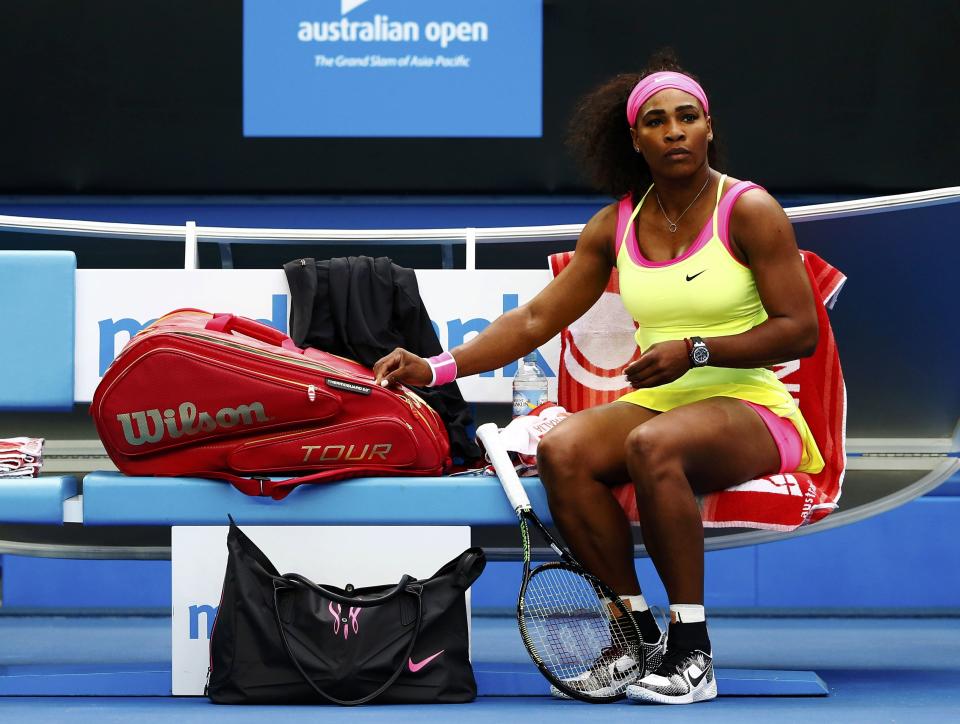 Williams of the U.S. sits before the start of her women's singles first round match against Van Uytvanck of Belgium at the Australian Open 2015 tennis tournament in Melbourne