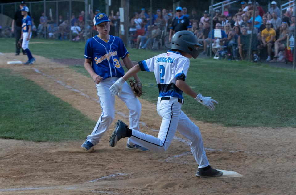Toms River East Christopher Tennaro crosses home for third run of game. Toms River East Little League shuts out Sunnybrae 3-0 to win Section 3 Championship in Hamilton, NJ on July 23, 2021. 