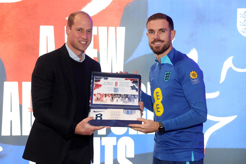 BURTON UPON TRENT, ENGLAND - NOVEMBER 14: Prince William, Prince of Wales presents an England shirt to Jordan Henderson at St George's Park on November 14, 2022 in Burton upon Trent, England. (Photo by Eddie Keogh - The FA/The FA via Getty Images)
