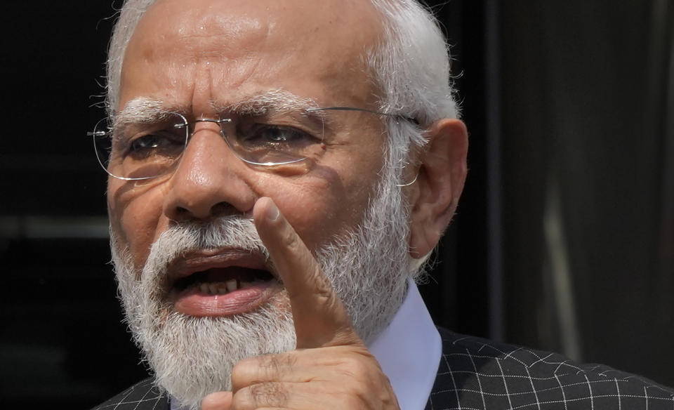 Indian Prime Minister Narendra Modi speaks as he arrives on the opening day of the monsoon session of the Indian parliament in New Delhi, India, Thursday, July 20, 2023. Modi Thursday broke more than two months of his public silence over the deadly ethnic clashes that have marred the country's remote northeast Manipur state, a day after a viral video showed two women being paraded naked by a mob, sparking outrage across the nation. (AP Photo/Manish Swarup)