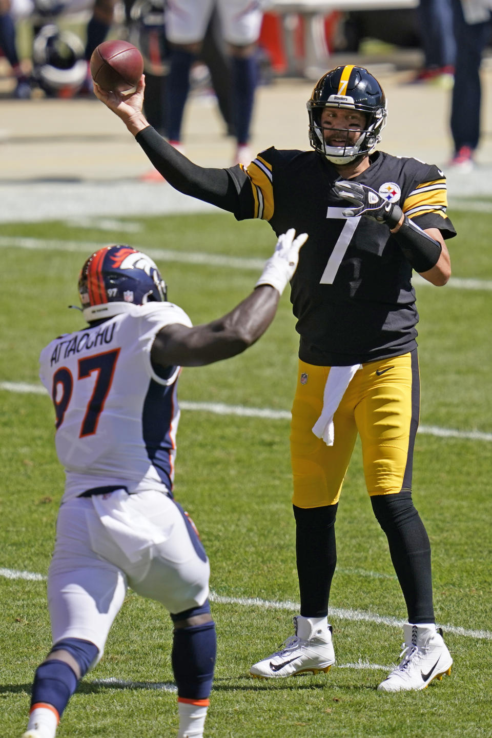 Pittsburgh Steelers quarterback Ben Roethlisberger (7) passes under pressure by Denver Broncos linebacker Jeremiah Attaochu (97) during the first half of an NFL football game, Sunday, Sept. 20, 2020, in Pittsburgh. (AP Photo/Keith Srakocic)