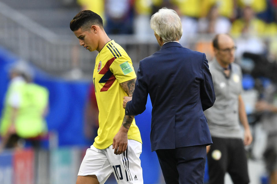 <p>Could his World Cup be over? Colombia’s James Rodriguez walks past head coach Jose Pekerman after coming injured in the first half </p>