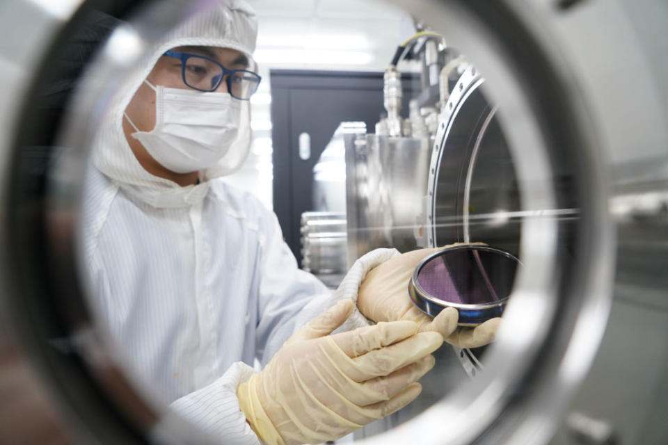 BEIJING, CHINA - MAY 26: A researcher deals with a wafer arrayed with carbon nanotubes (CNT) at a laboratory on May 26, 2020 in Beijing, China. (Photo by VCG/VCG via Getty Images)