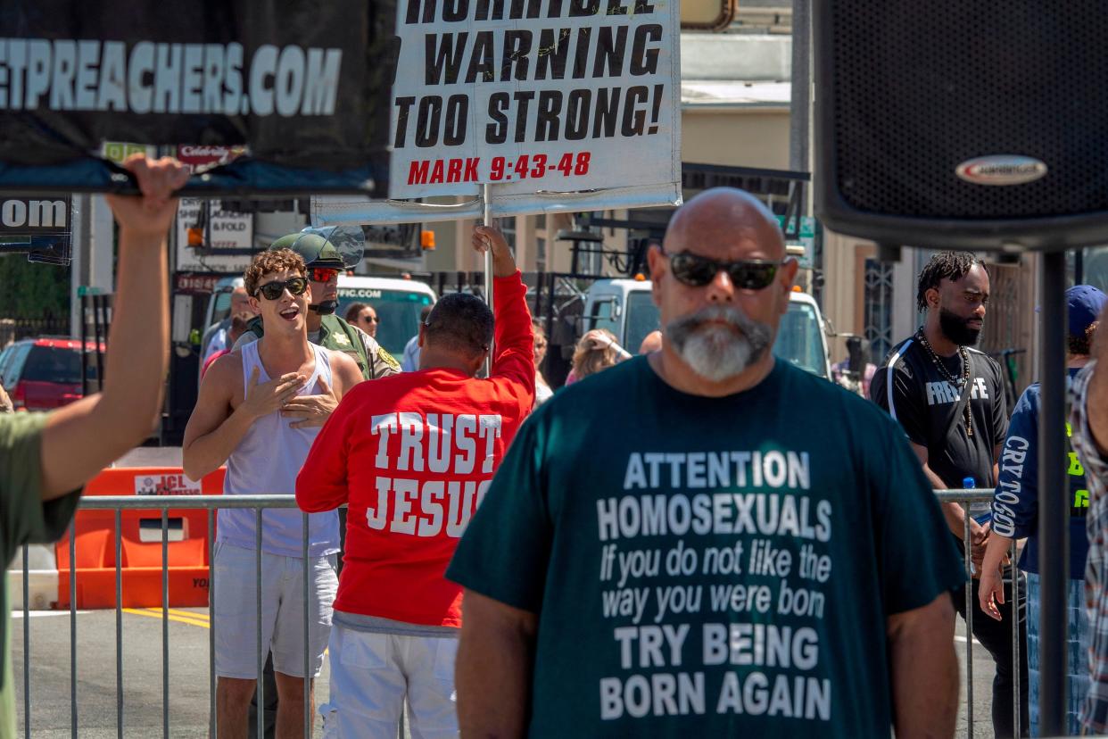 Anti-LGBTQ evangelical Christian preachers confront people at the annual LA Pride Parade in West Hollywood, Calif., in June 2019. Multiple studies indicate that young women are now leaving the Christian church at higher rates than young men, reversing the patterns of previous generations. Experts say the stance of conservative churches regarding LGBTQ rights is among the reasons why.