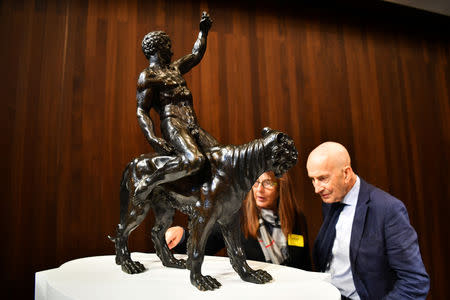 Art lovers take a close-up look at 'Rothschild Bronzes', confirmed as the only surviving bronze sculpture by Michelangelo, during an event at The Royal Academy of Arts (RA) in London, Britain, November 14, 2018. REUTERS/Dylan Martinez