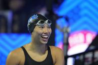 Torri Huske reacts after winning the Women's 100 Butterfly during wave 2 of the U.S. Olympic Swim Trials on Monday, June 14, 2021, in Omaha, Neb. (AP Photo/Charlie Neibergall)