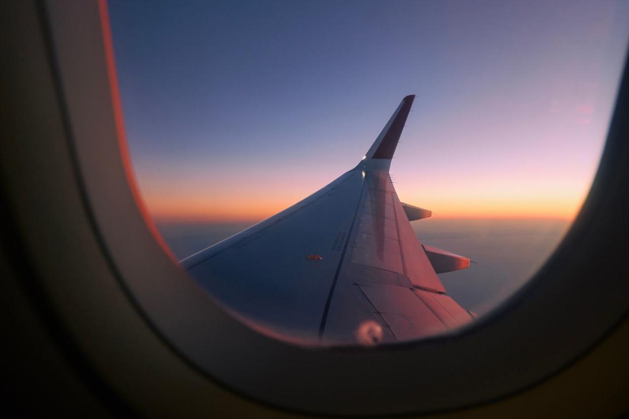 view of airplane wing from airplane window